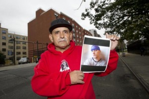 Ramon Echavarria with a picture of his son, Jason, who died on Rikers Island in 2012. Photo: Howard Simmons, NY Daily News