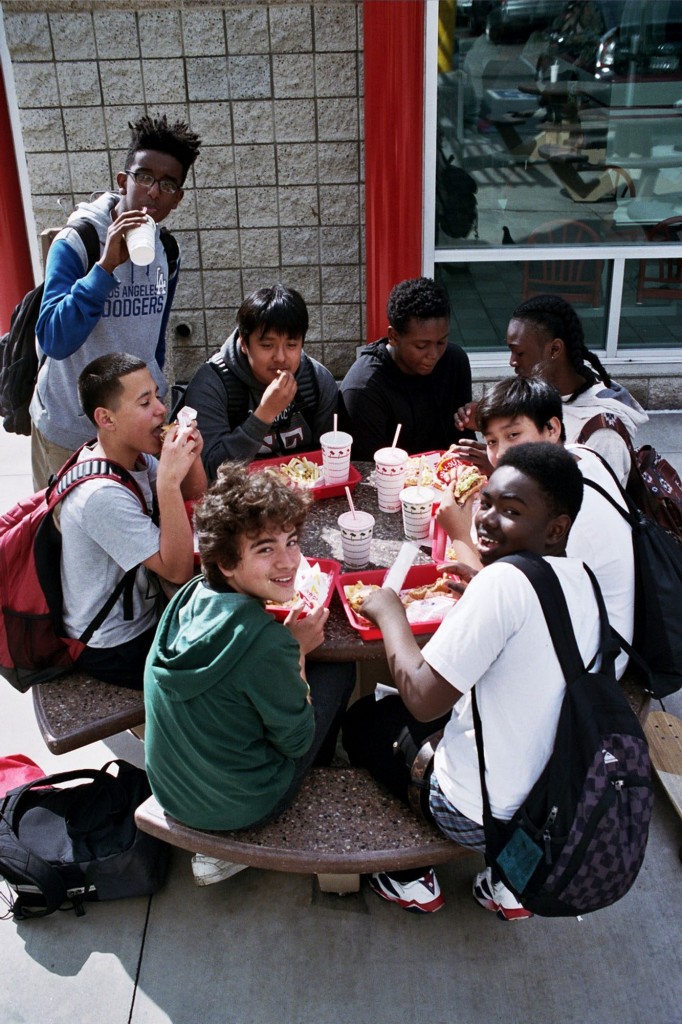 Happy kids eating in a fast food joint. Photo by Hannah Taylor for Keith (NY).